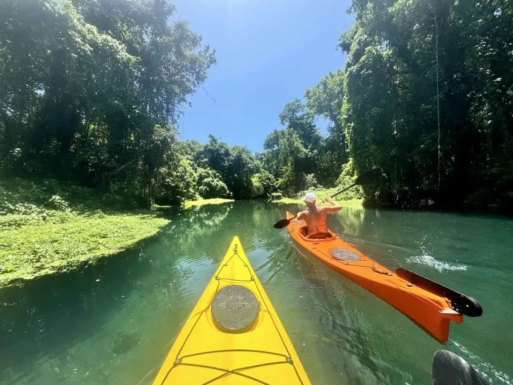 Kayaking up the Matevulu River to the blue hole near Turtle Bay Lodge